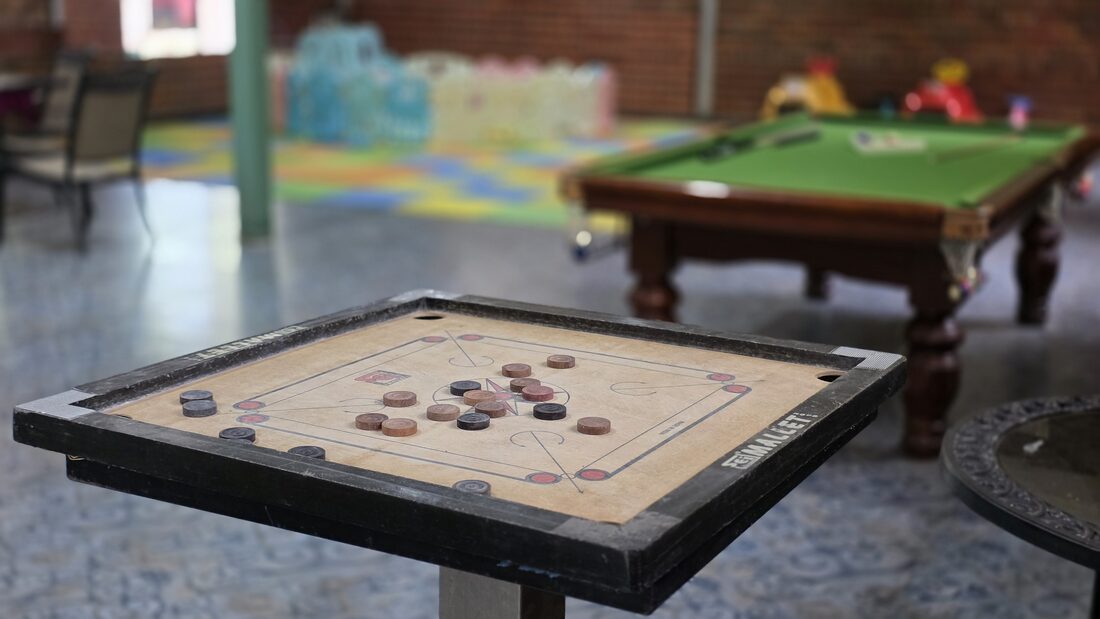 Carrom board set up in the games hall