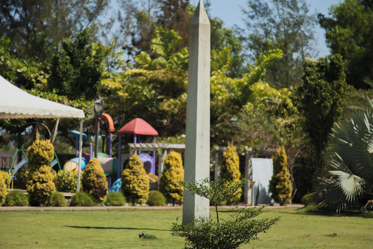 Open lawn with topiary and play area at UVA Meridian