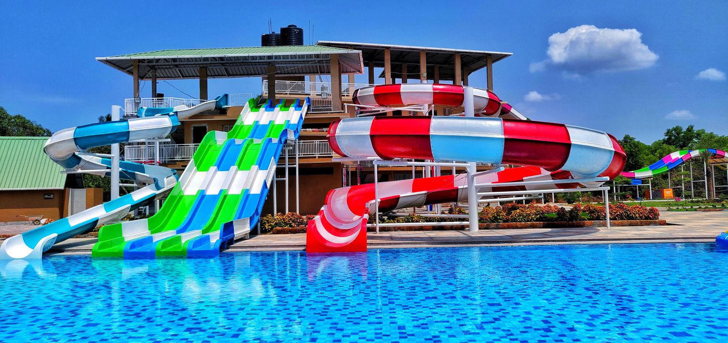 Multi-lane speed slides and tube slides above the pool at UVA Meridian Water Park