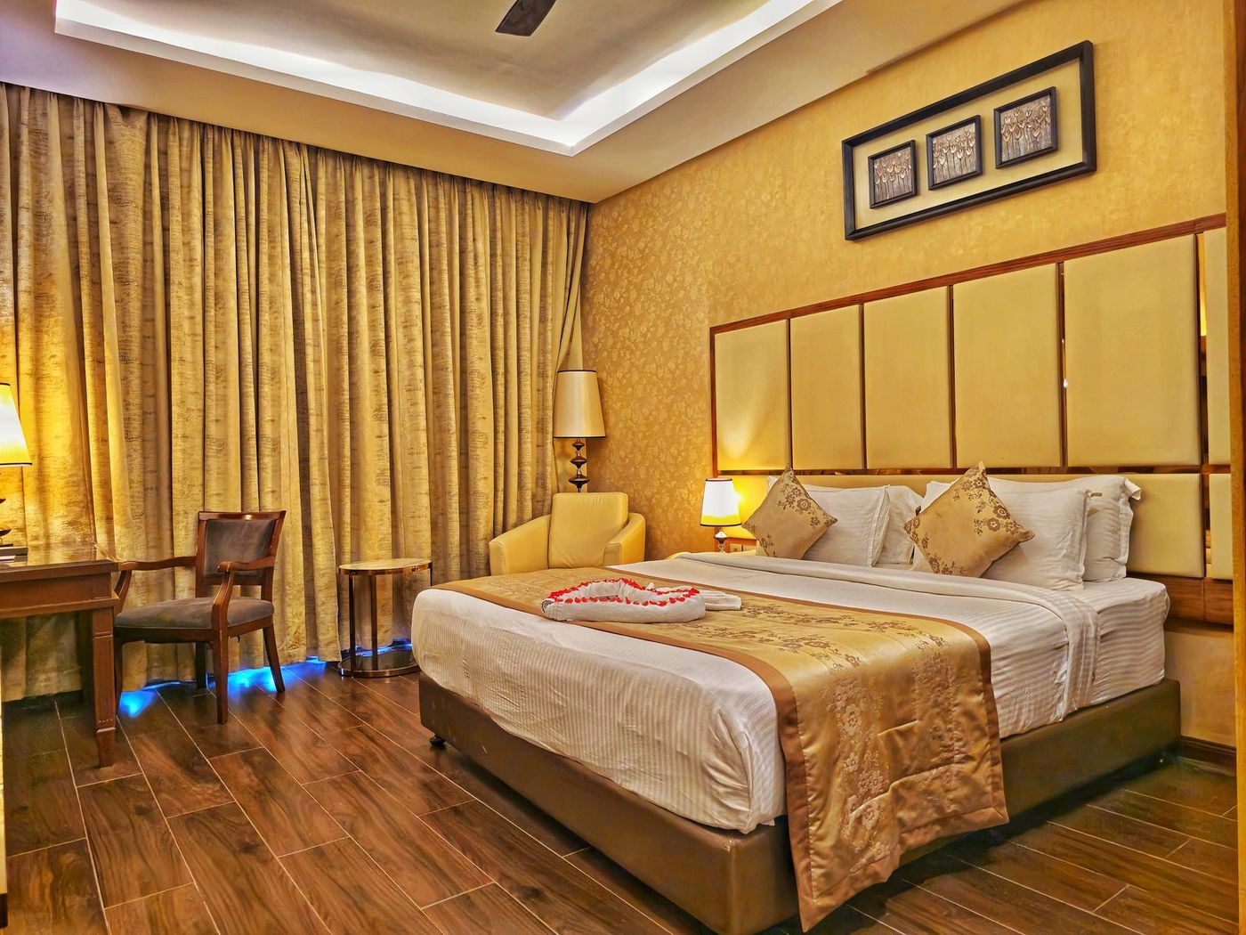 Superior Room with double bed and warm lighting at UVA Meridian Bay Resort